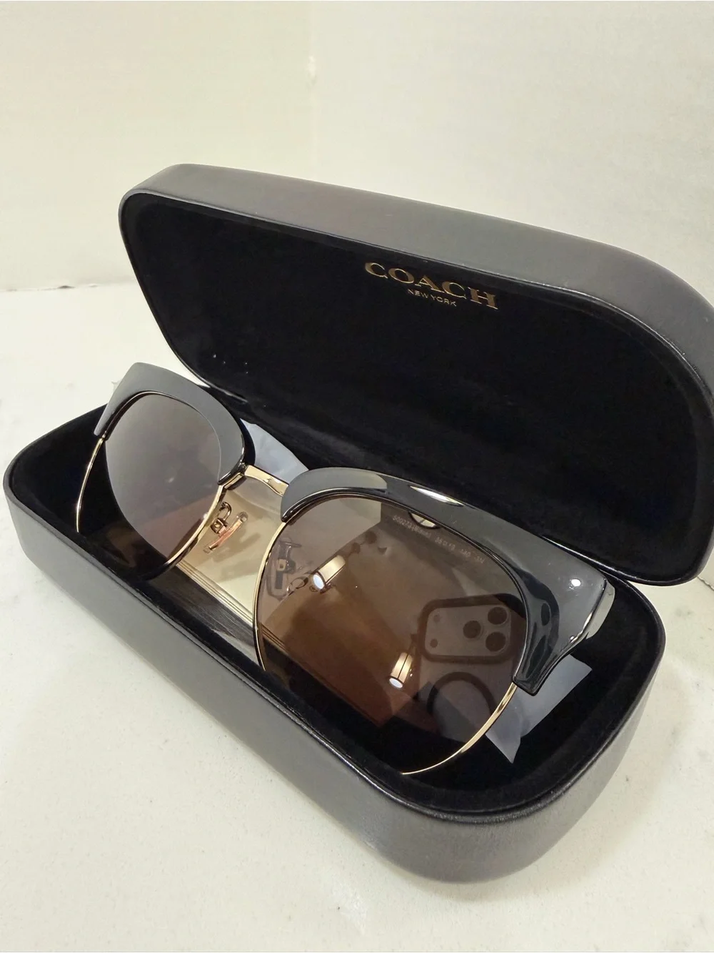 Coach Black Frame Sunglasses with Gold Trim and Brown Lenses